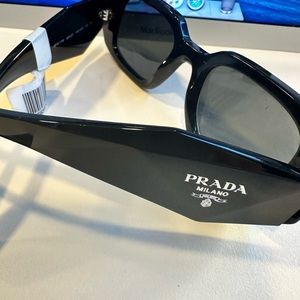 Brand new with tags Prada Sunglasses. Retail for $433.